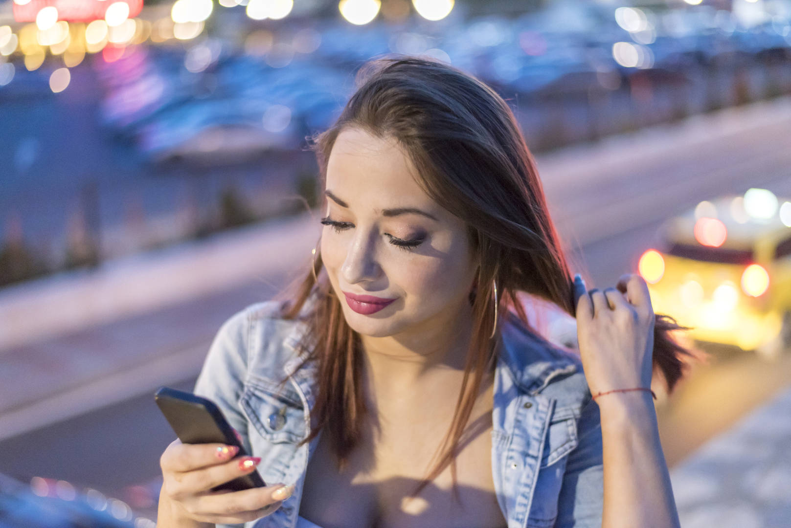 woman on smartphone in urban setting