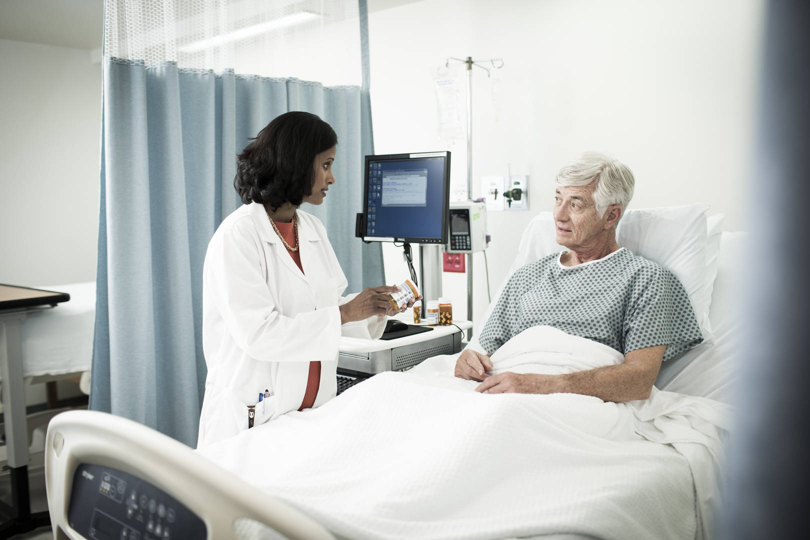 Physician discussing medication bedside